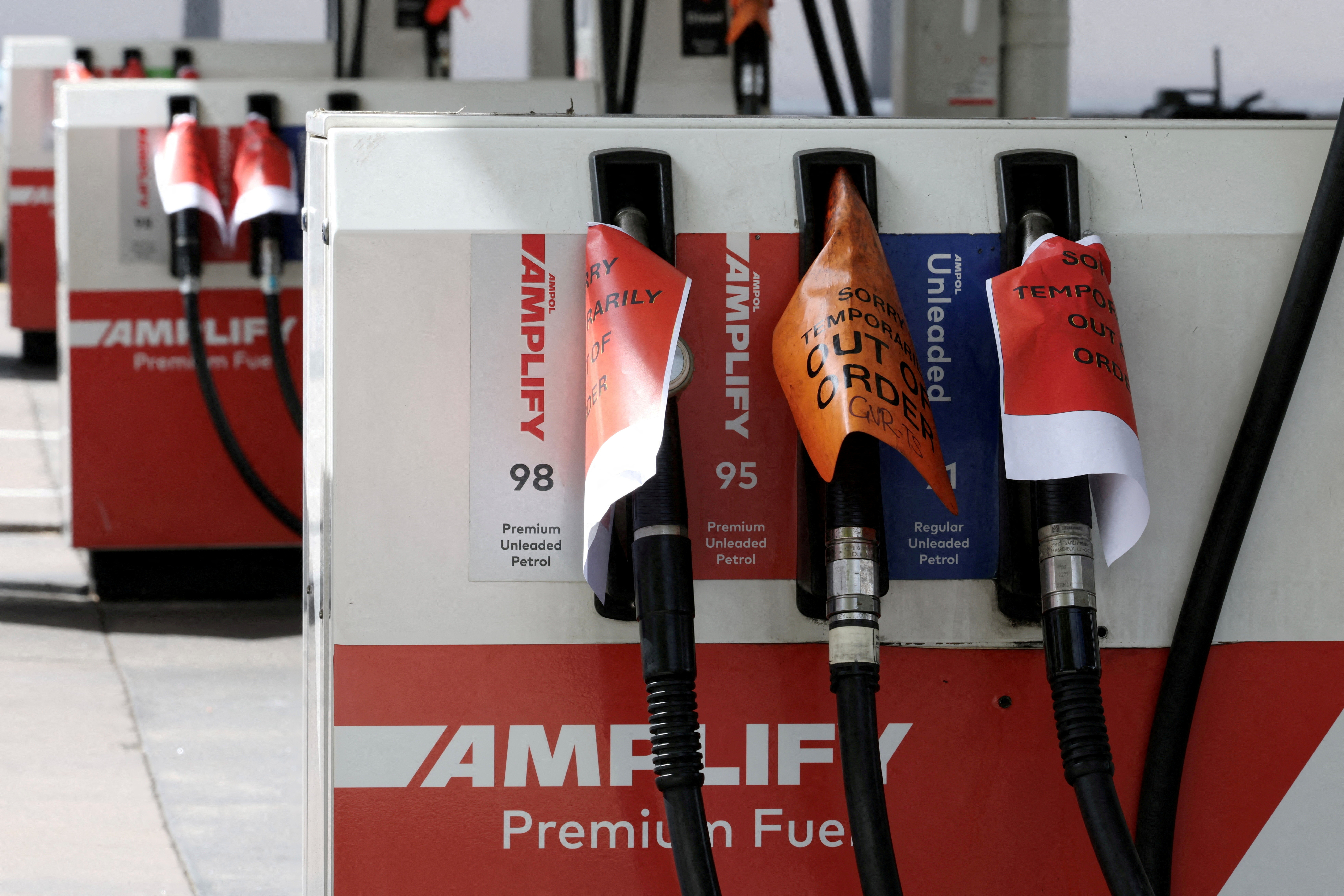 FILE PHOTO: Empty fuel pumps at an Ampol petrol station in Sydney