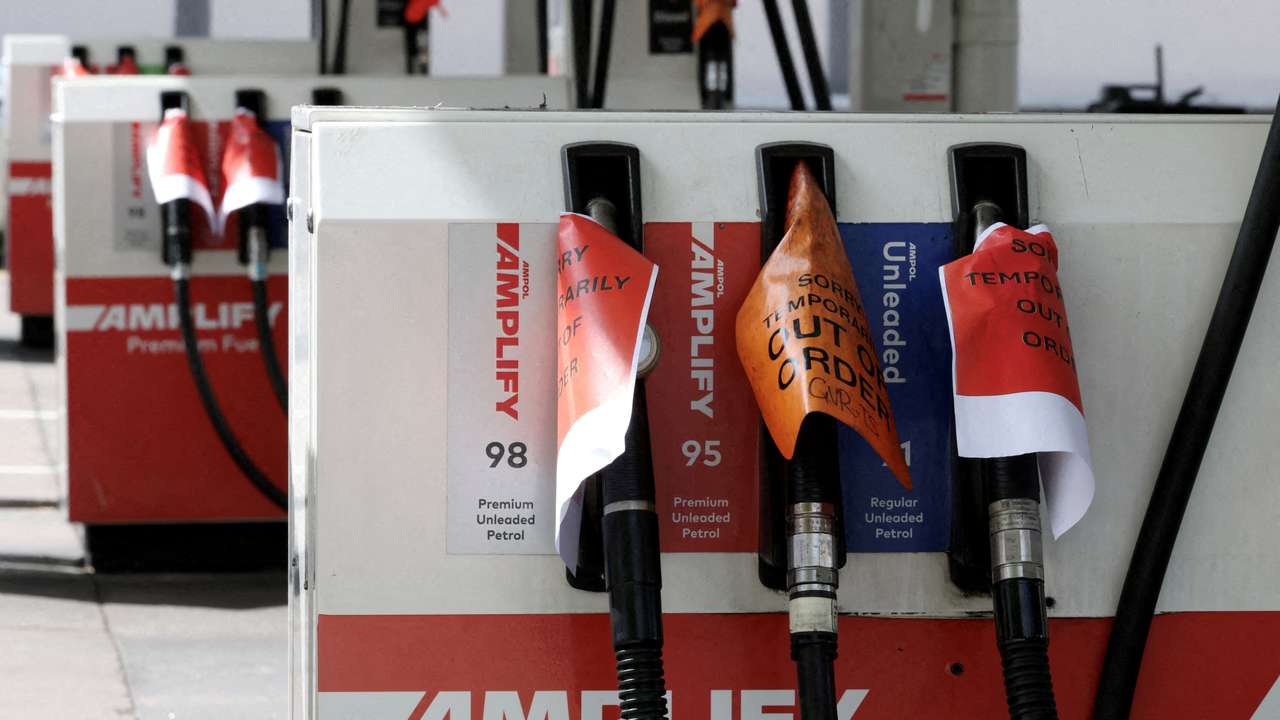FILE PHOTO: Empty fuel pumps at an Ampol petrol station in Sydney