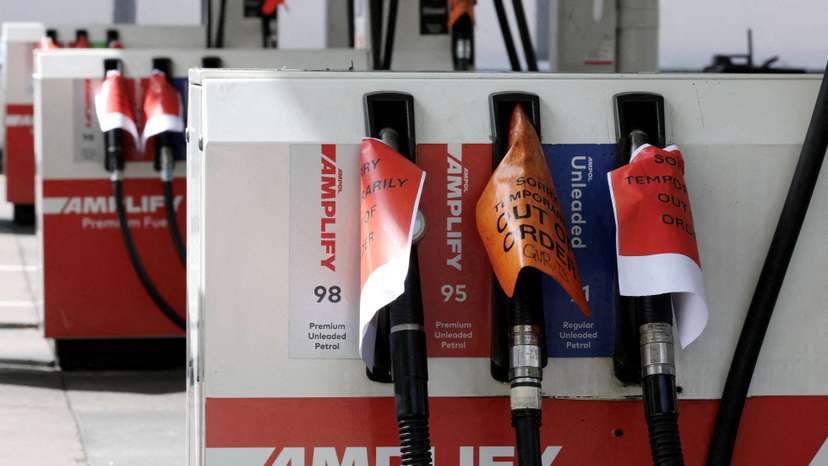 FILE PHOTO: Empty fuel pumps at an Ampol petrol station in Sydney