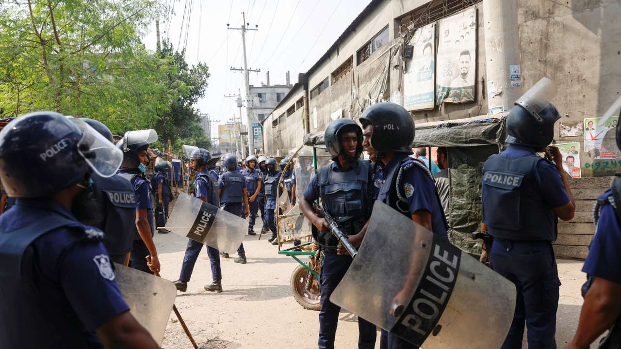 Security forces remain vigilant in front of the garment factories, following clashes between garment industry workers and police over pay, at the Ashulia area