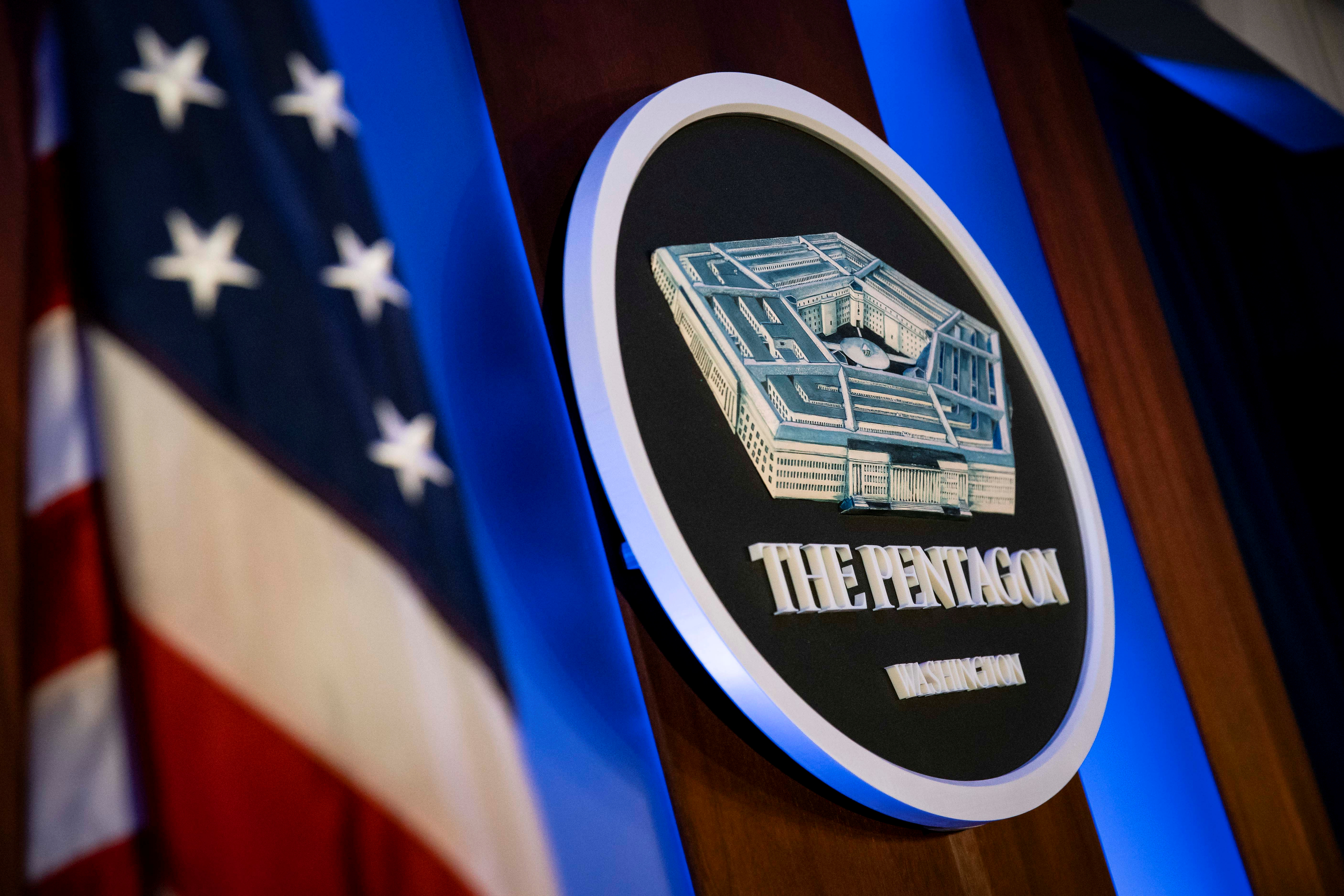 FILE PHOTO:  The Pentagon logo is seen behind the podium in the briefing room at the Pentagon in Arlington
