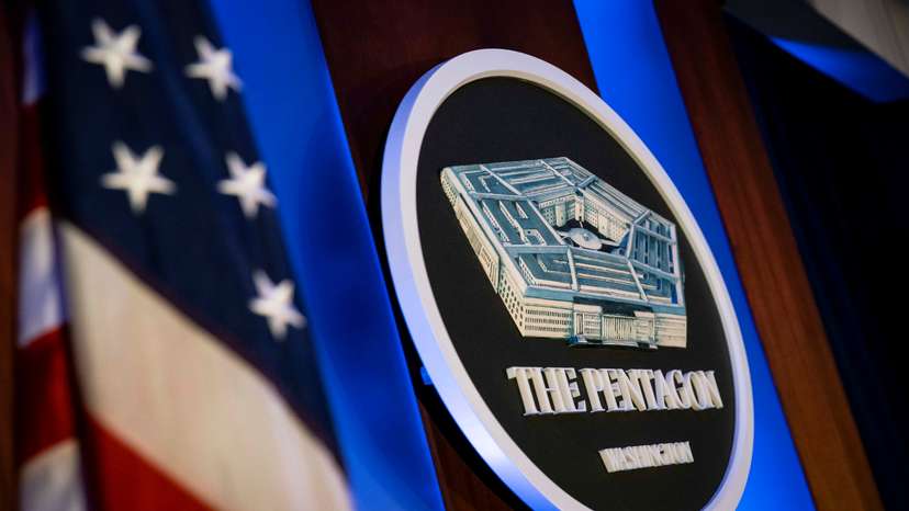 FILE PHOTO: The Pentagon logo is seen behind the podium in the briefing room at the Pentagon in Arlington