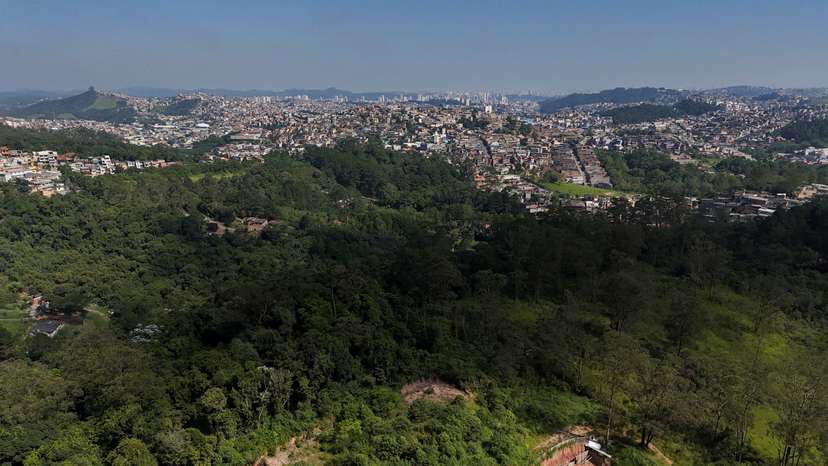 FILE PHOTO: A drone view shows the city and an area under permanent protection that was illegally deforested, in Maua