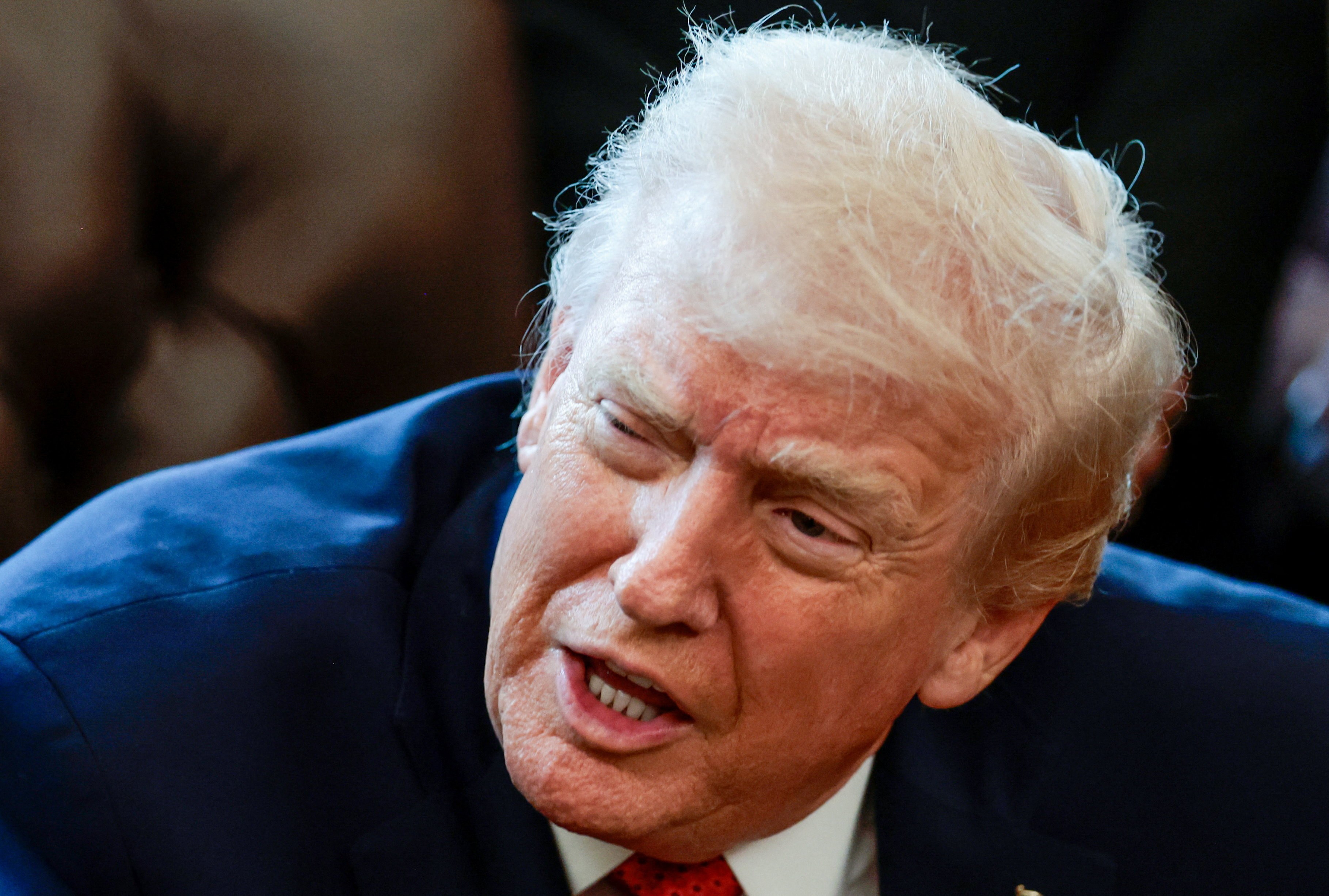 U.S. President Trump signs executive orders at the Oval Office, in Washington