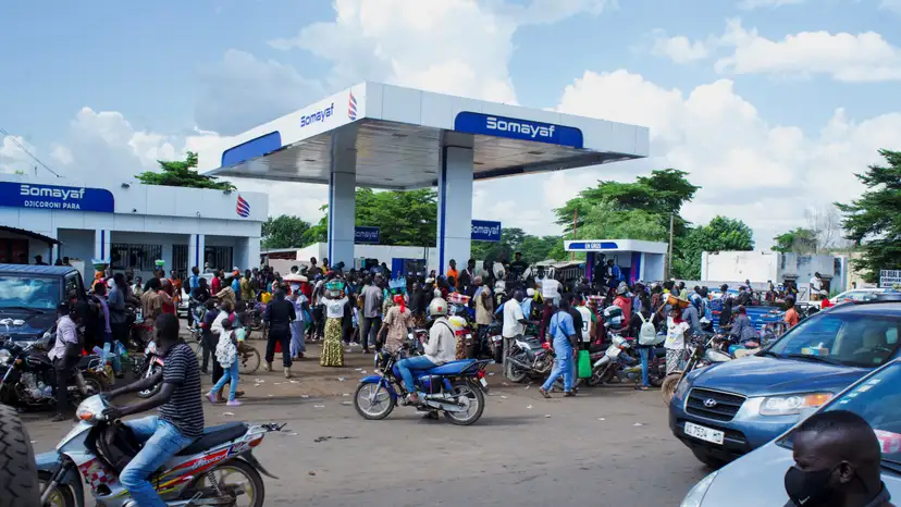 People gather at a petrol station due to shortage of petrol in Bamako