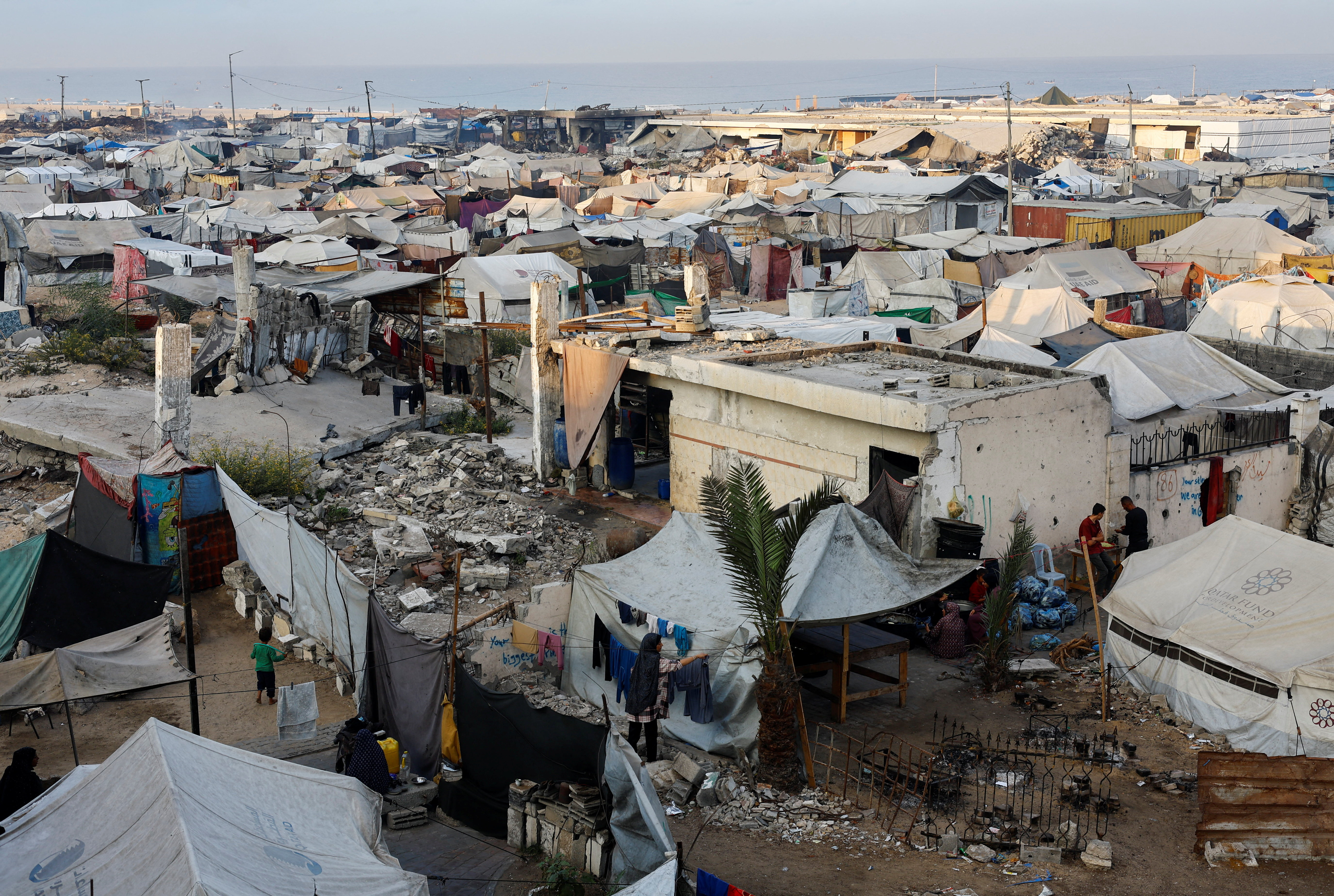 Palestinians take shelter in their tents, during a ceasefire between Israel and Hamas, in Gaza City