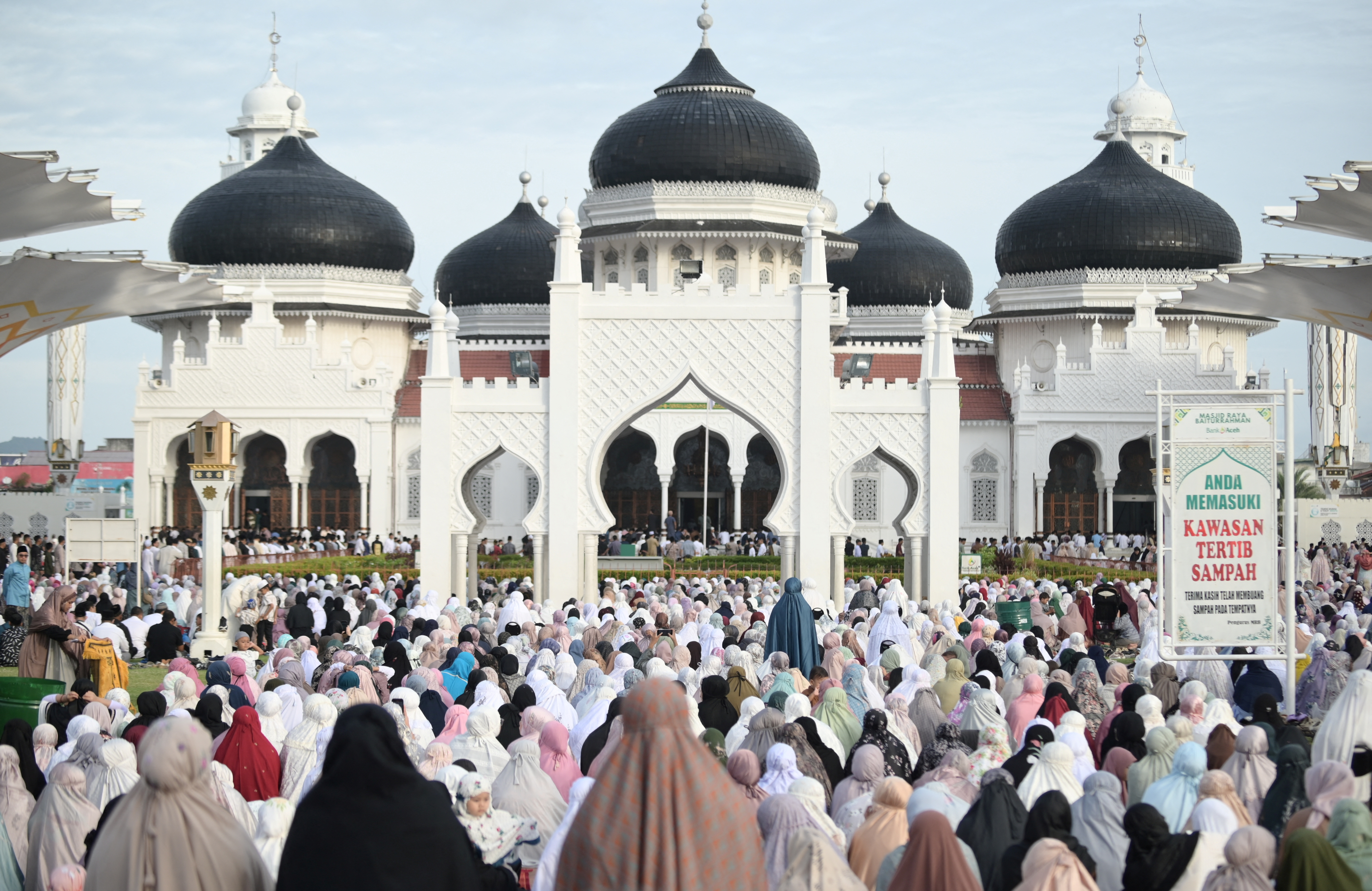 Indonesian Muslim women attend mass prayers at Baiturrahman mosque during Eid al-Adha in Banda Aceh