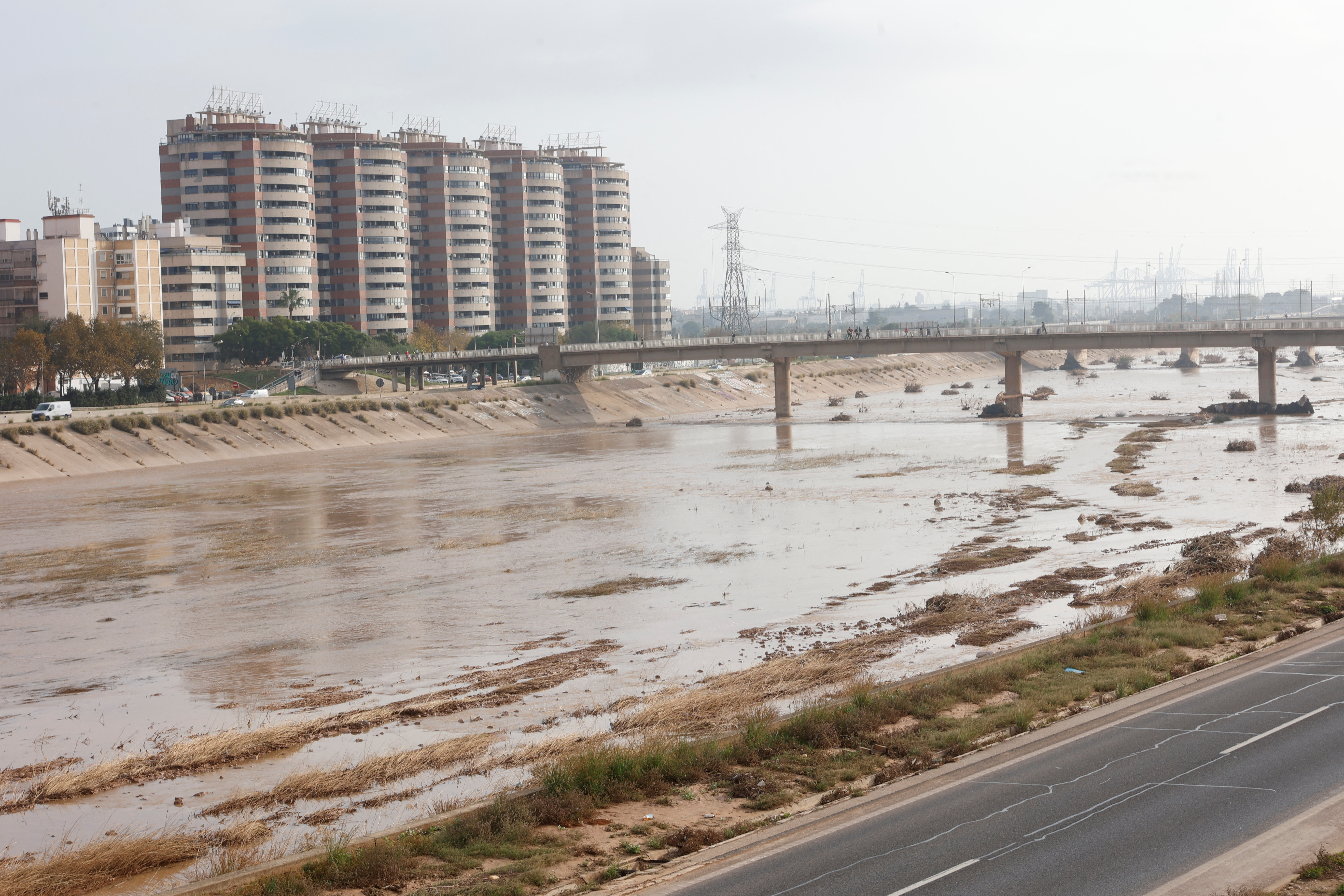 People walk on one of the bridges over the new Turia riverbed that connects Valencia with the towns in the south of the metropolitan area in Valencia
