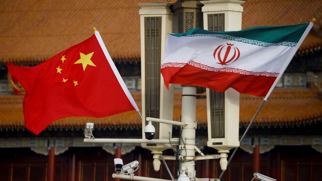 Flags of China and Iran fly in Tiananmen Square during Iranian President Raisi's visit to Beijing