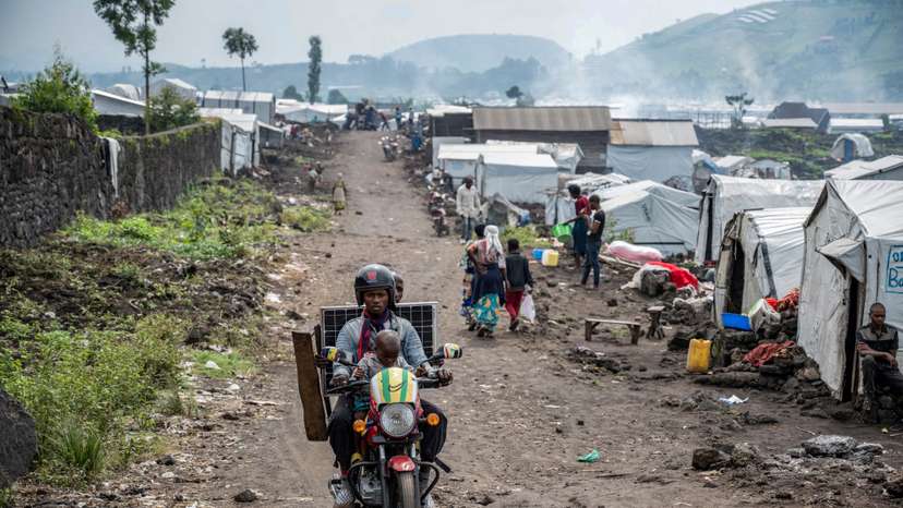 FILE PHOTO: Displaced Congolese people prepare to leave camp as M23 rebels order evacuations near Goma