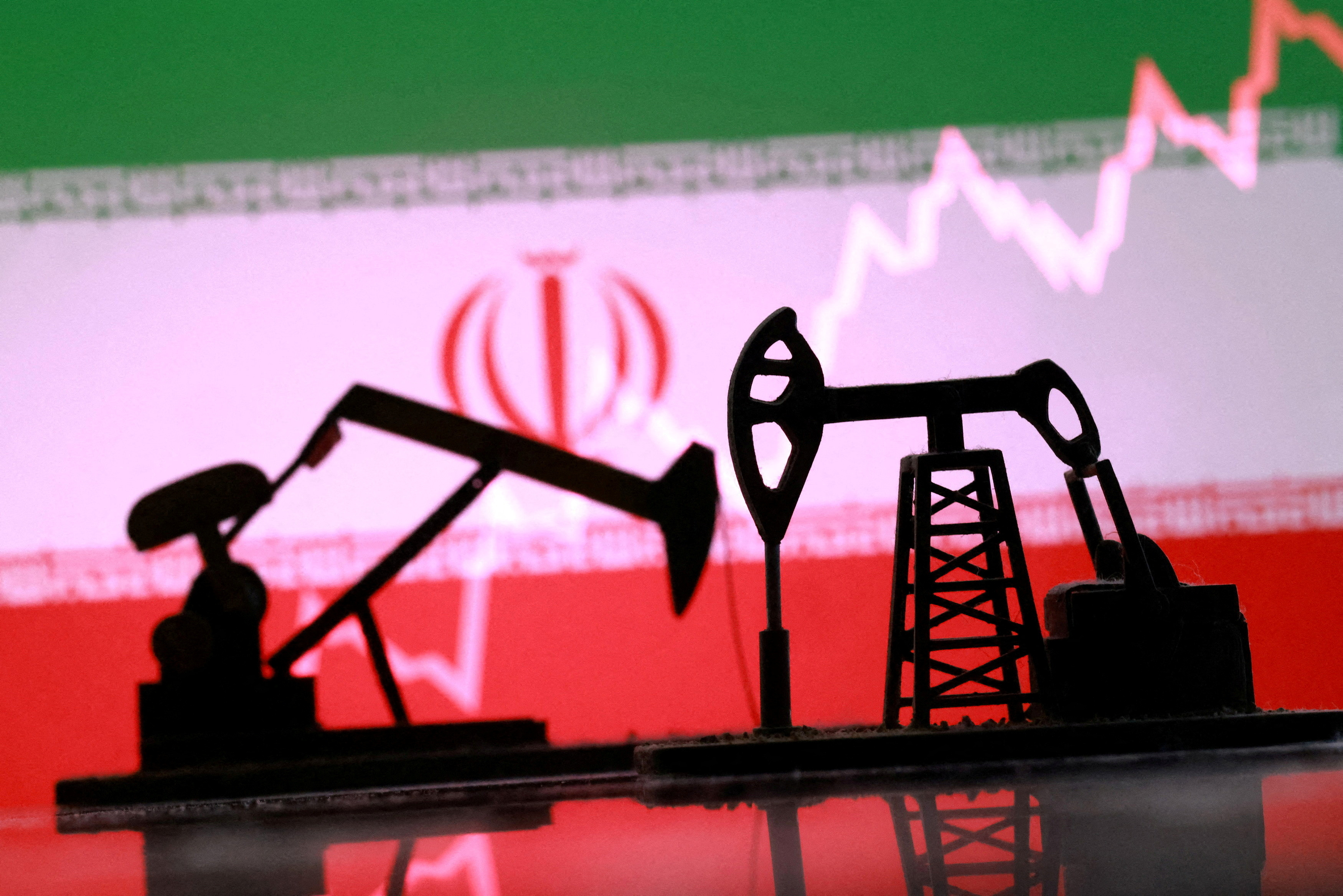 FILE PHOTO: Illustration shows 3D printed oil pump jacks, Iranian flag, rising stock graph
