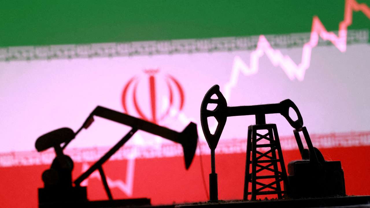 FILE PHOTO: Illustration shows 3D printed oil pump jacks, Iranian flag, rising stock graph