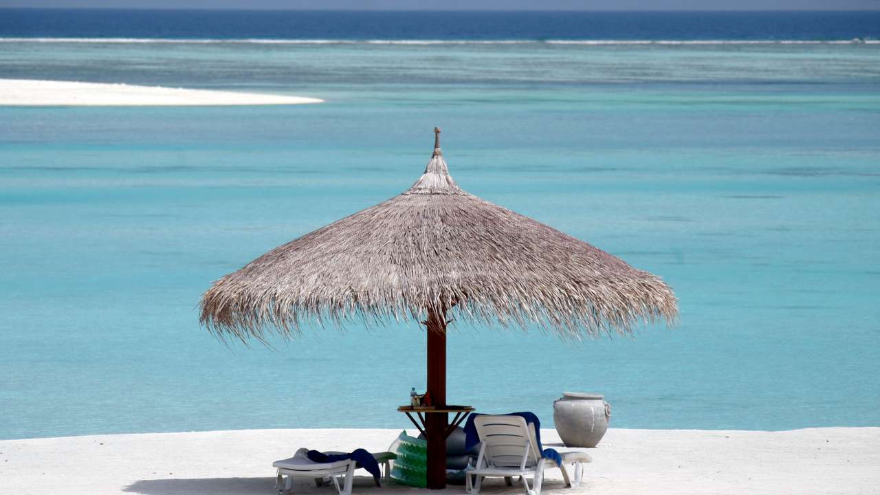 General view of the sandy beach of Olhuveli island in Maldives