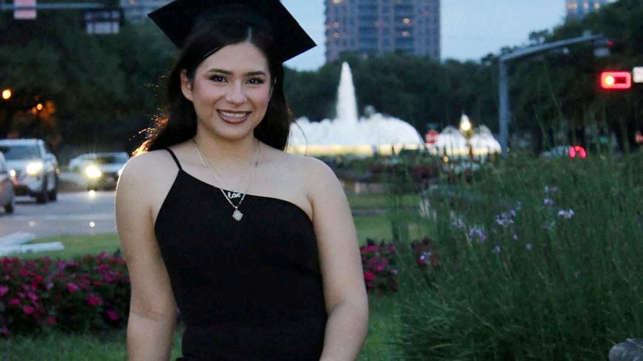 FILE PHOTO: Babson College student Any Lucia Lopez Belloza poses wearing a mortarboard after graduating from high school in Boston