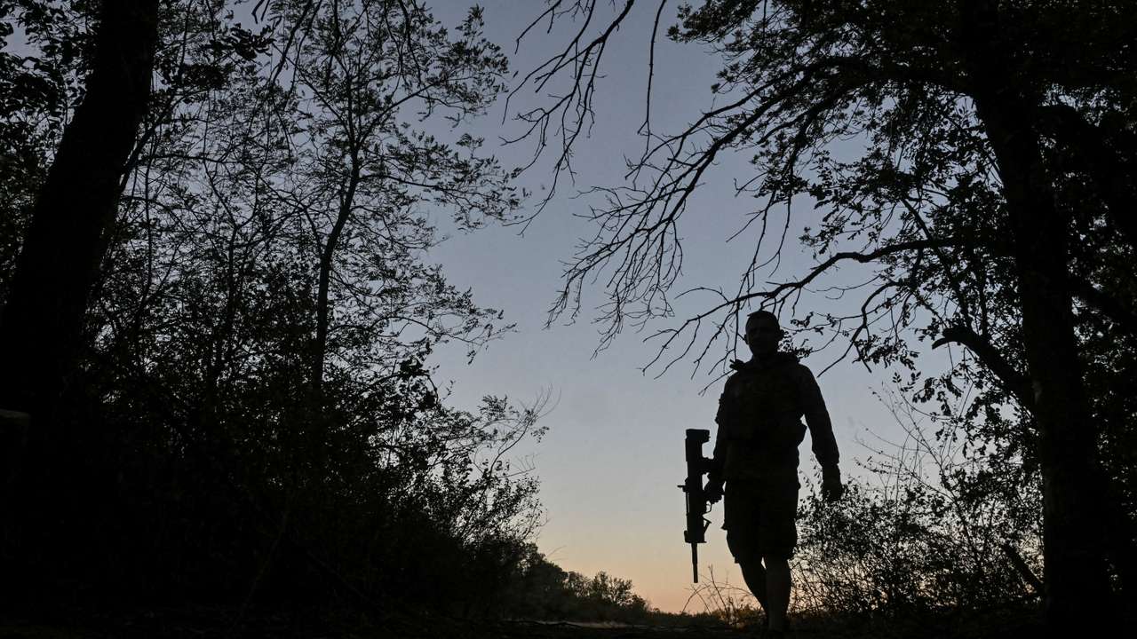 Ukrainian serviceman walks at a position near a front line in Donetsk region