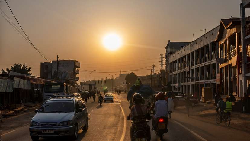 Residents commute along a street in downtown Kigali
