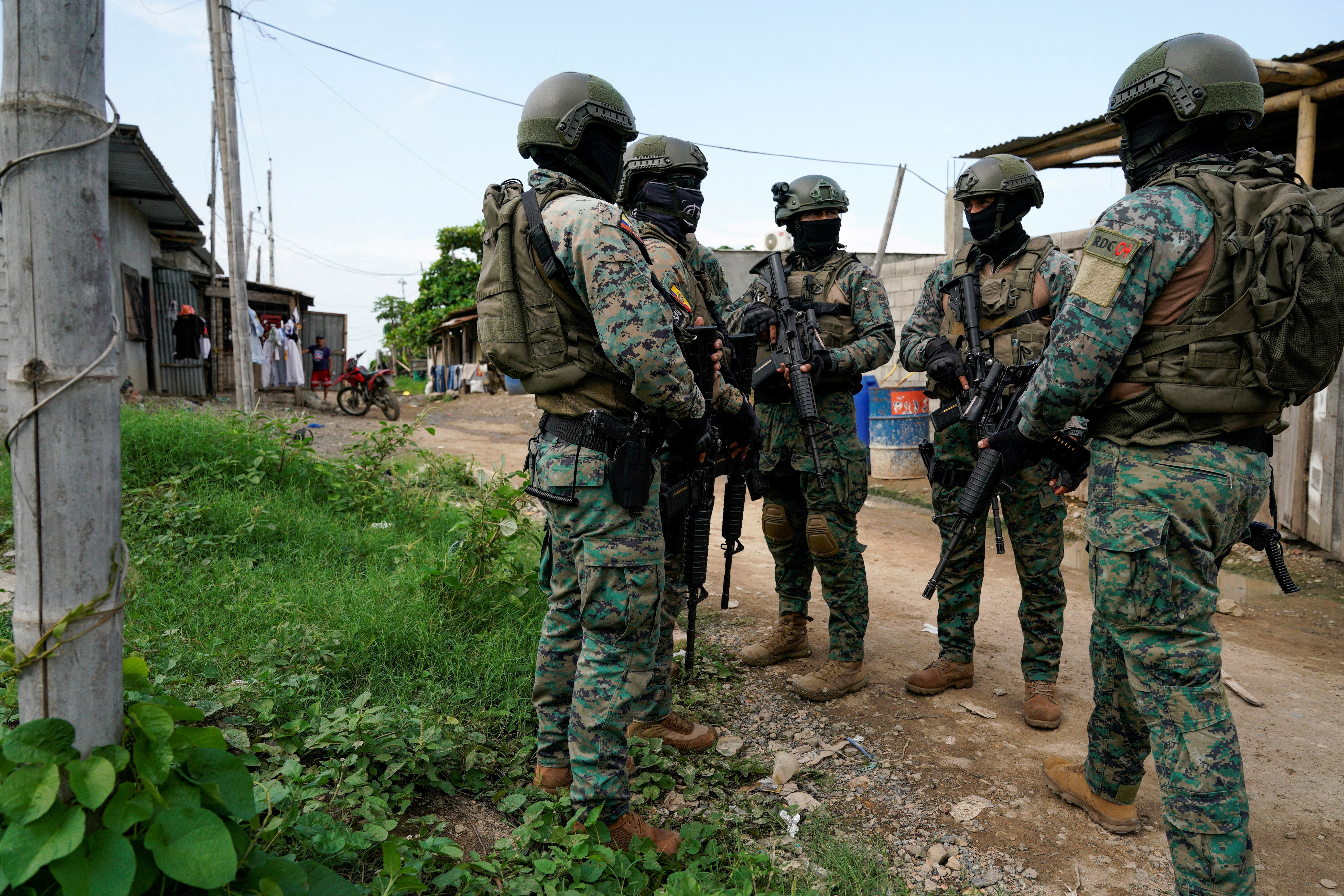 FILE PHOTO: Police and military patrol a neighbourhood, in Duran
