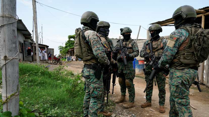 FILE PHOTO: Police and military patrol a neighbourhood, in Duran