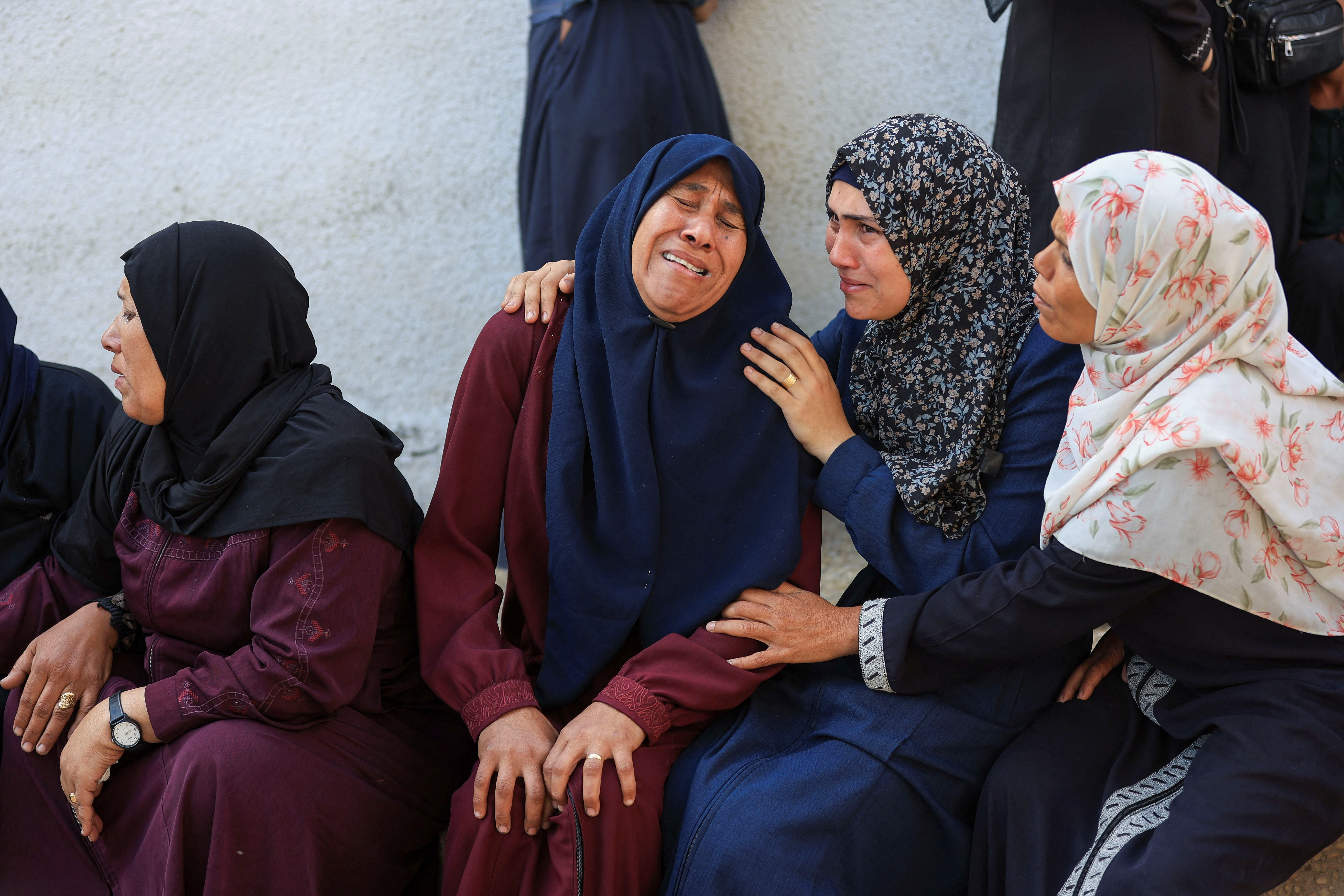 Mourners gather during the funeral of Palestinians who were killed, according to medics, in Israeli strikes, at Al-Shifa hospital, in Gaza City