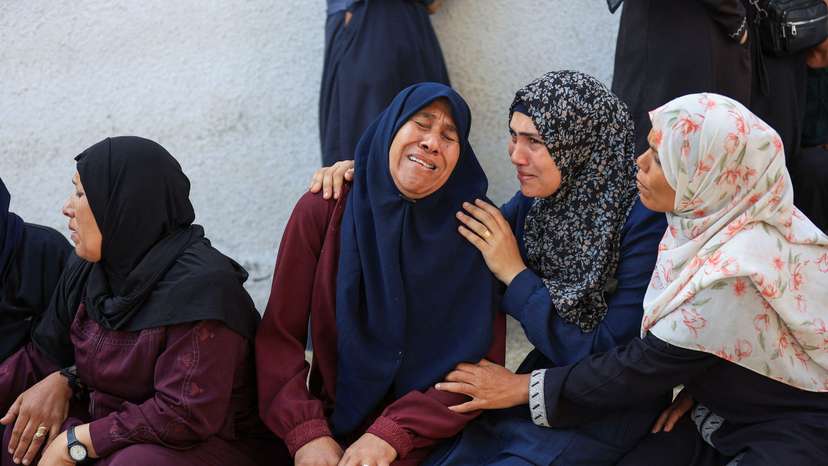 Mourners gather during the funeral of Palestinians who were killed, according to medics, in Israeli strikes, at Al-Shifa hospital, in Gaza City
