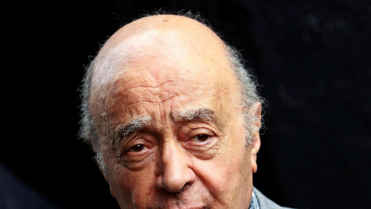FILE PHOTO: Fulham's chairman Mohamed Al Fayed listens as Fulham's new manager Mark Hughes speaks during a news conference at Craven Cottage stadium in London