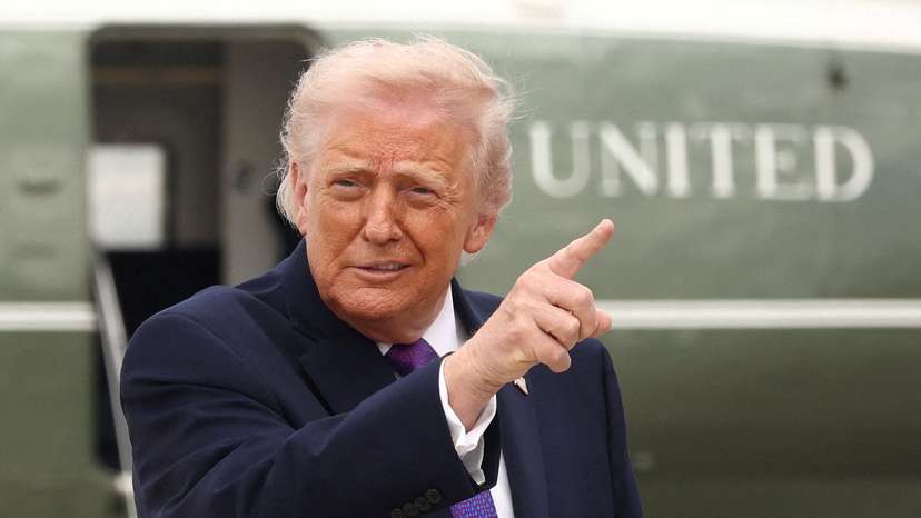 U.S. President Donald Trump gestures at Joint Base Andrews in Maryland