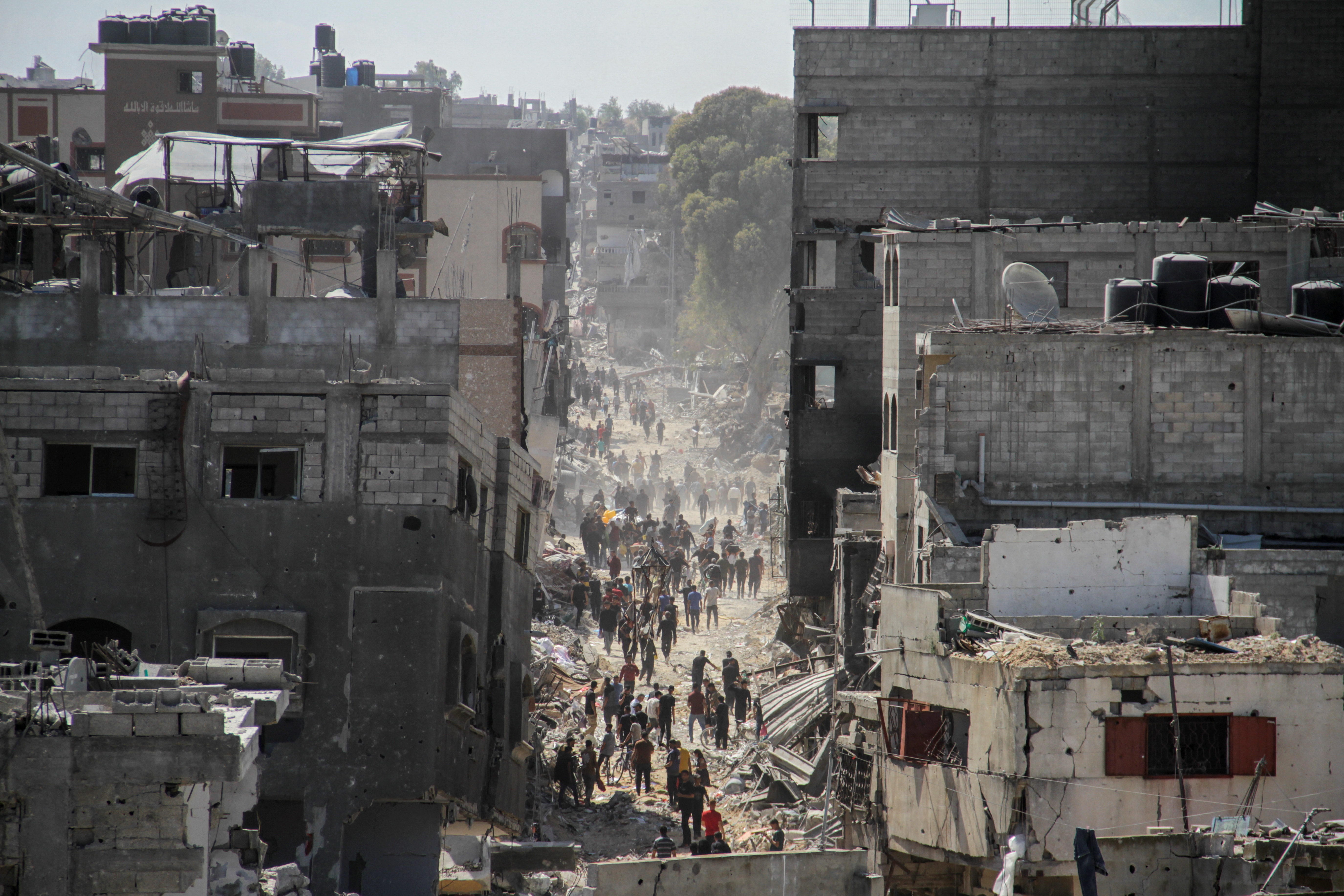Palestinians inspect the damages after Israeli forces withdrew from a part of Jabalia refugee camp, in the northern Gaza Strip
