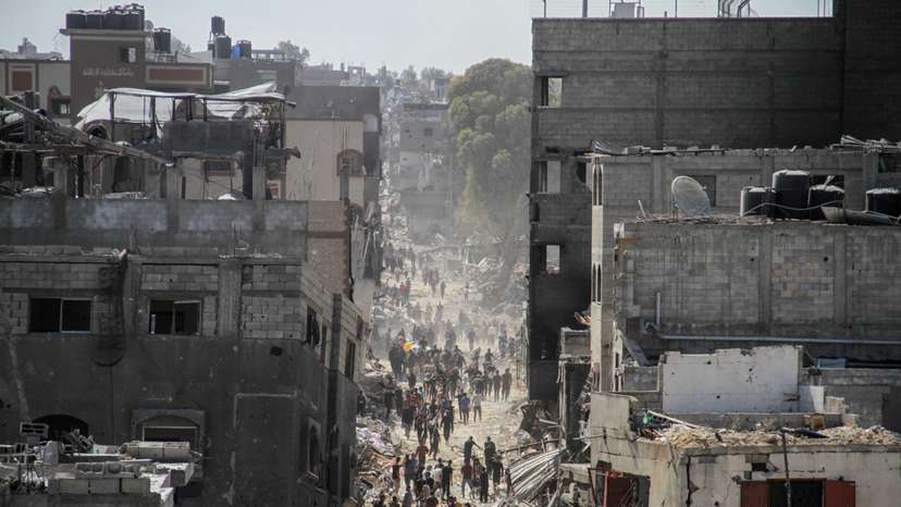 Palestinians inspect the damages after Israeli forces withdrew from a part of Jabalia refugee camp, in the northern Gaza Strip