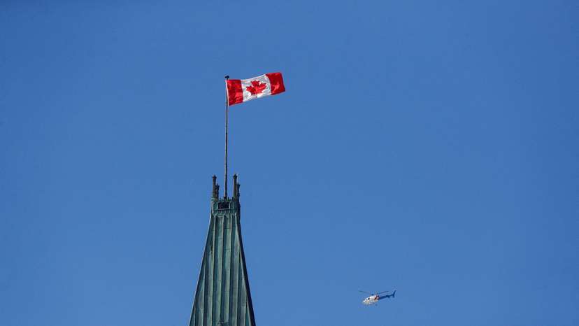 FILE PHOTO: RCMP helicopter flies past the Peace Tower on Parliament Hill in Ottawa