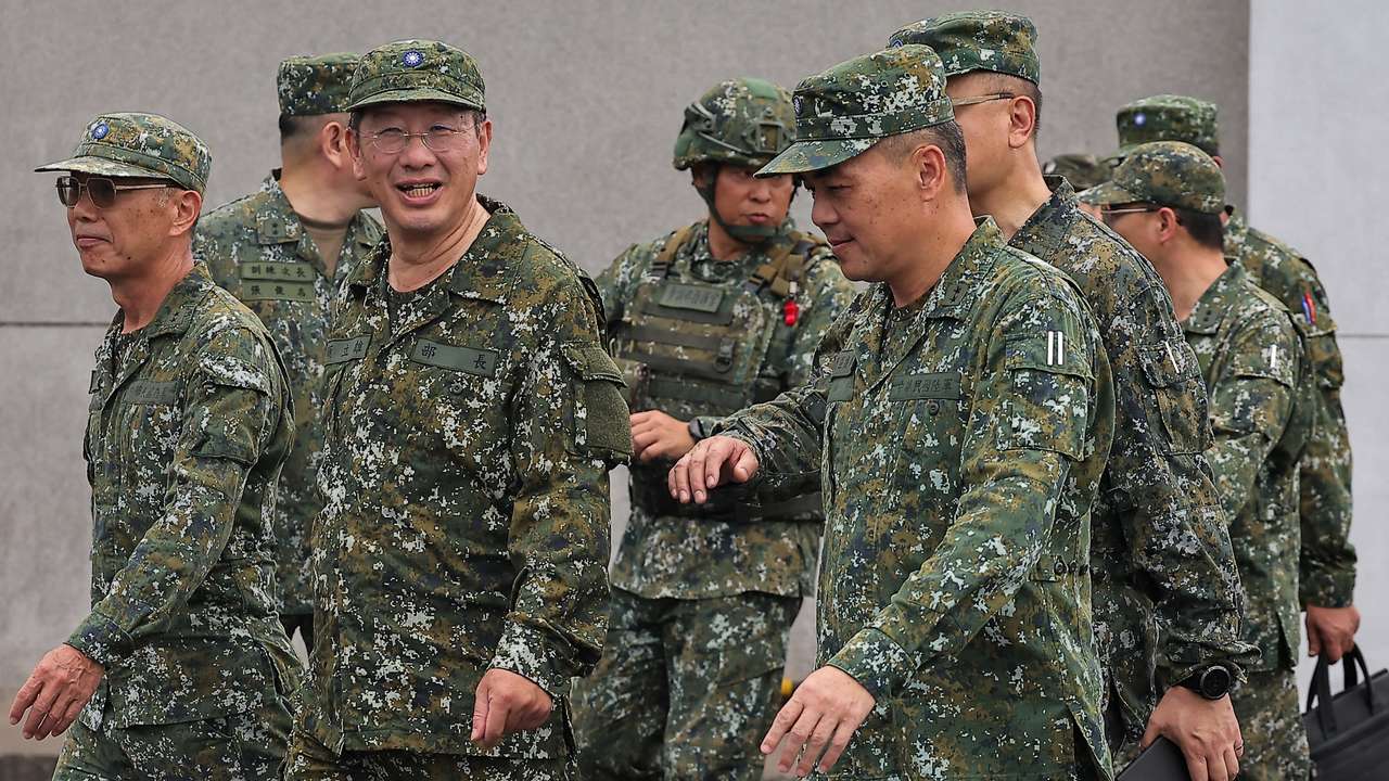 Defence Minister Wellington Koo inspects troops during a live fire exercise at the Fangshan training grounds in Pingtung