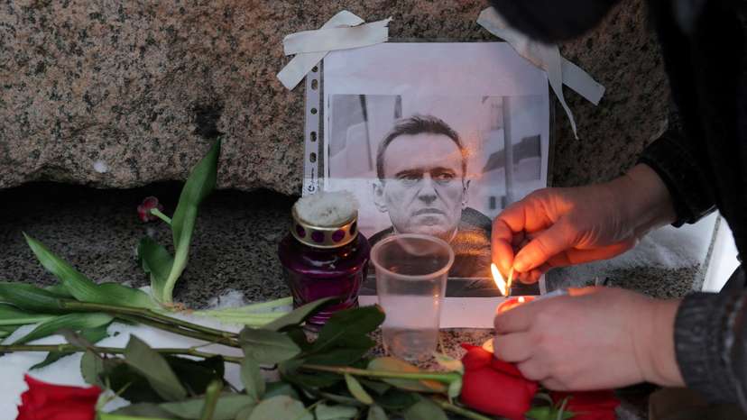 People gather at the monument to the victims of political repressions following the death of Alexei Navalny in Saint Petersburg