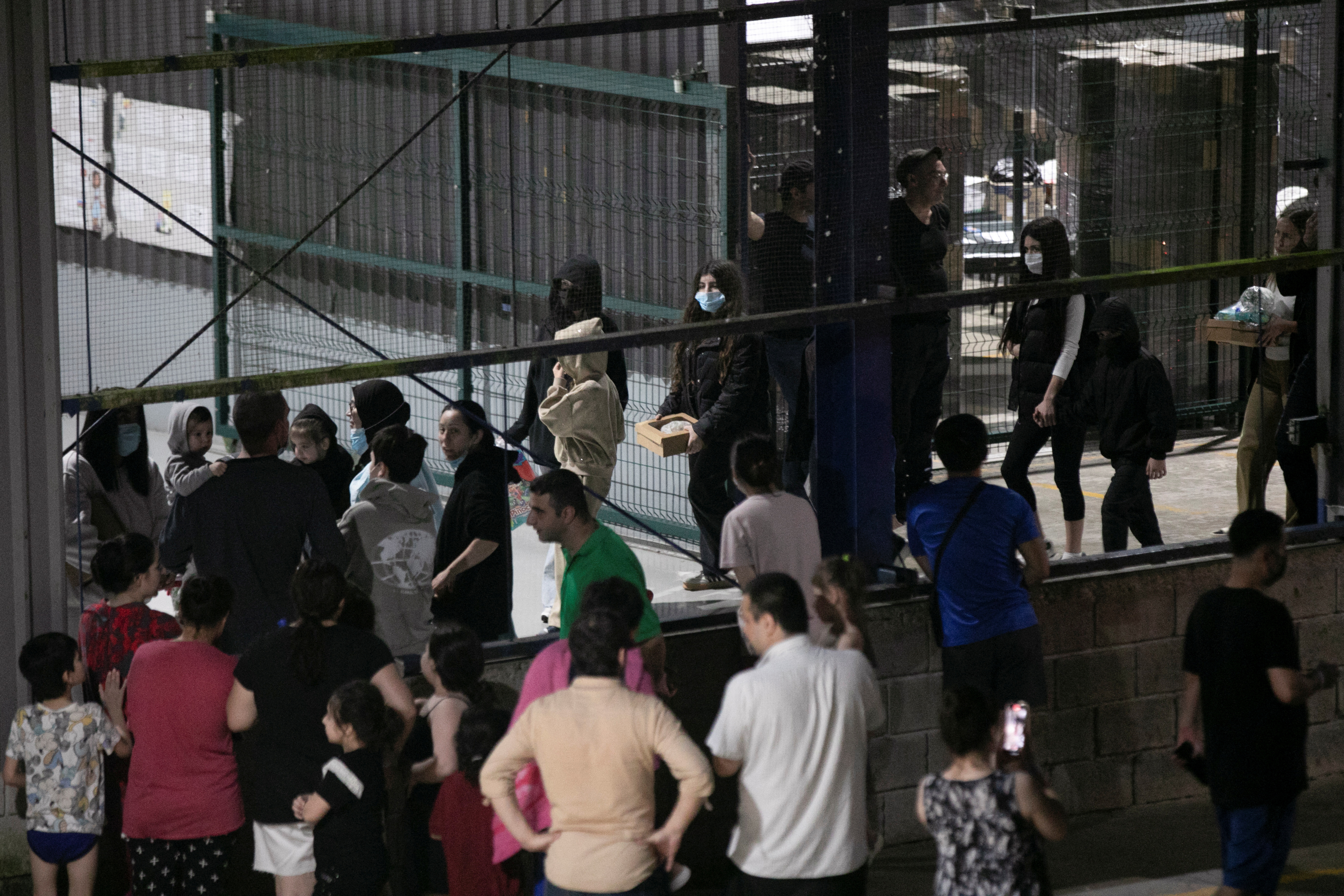 Migrants, who arrived on a deportation flight from the U.S, are seen at CATEM, in Puntarenas