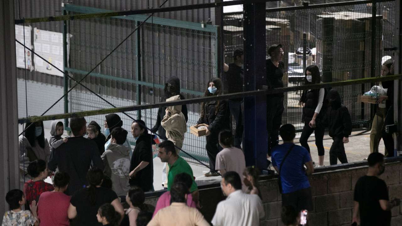 Migrants, who arrived on a deportation flight from the U.S, are seen at CATEM, in Puntarenas