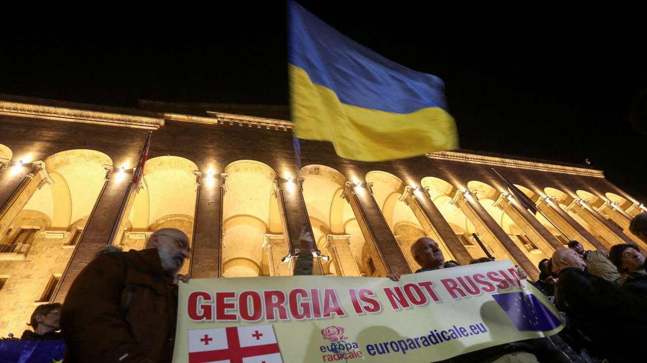 FILE PHOTO: Protesters gather outside Georgian parliament after disputed election