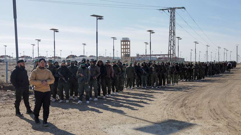 FILE PHOTO: Detainees gather at al-Hol camp after the Syrian government took control of it, in Hasaka