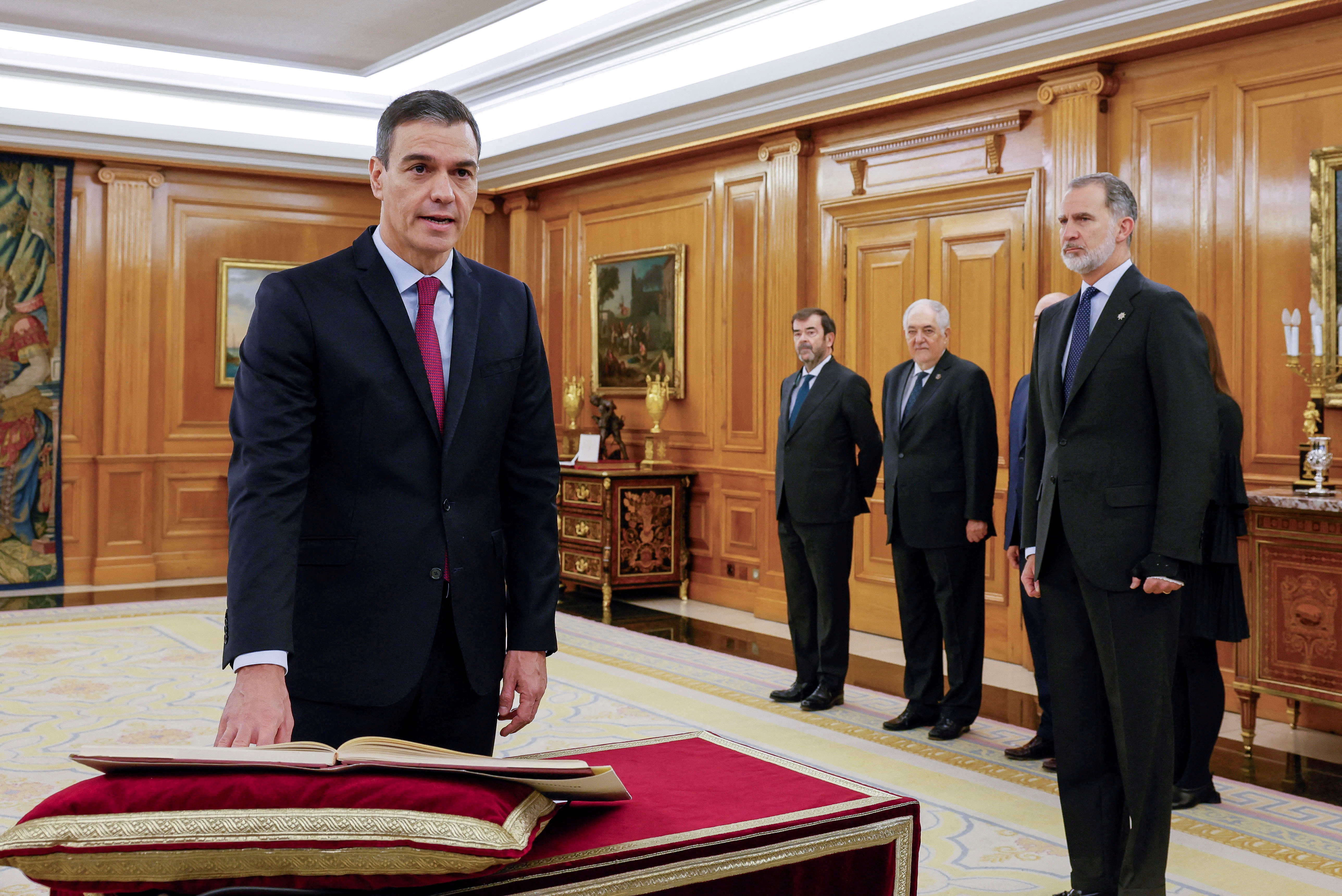 Spain's PM Sanchez takes the oath of office during a ceremony at Zarzuela Palace in Madrid