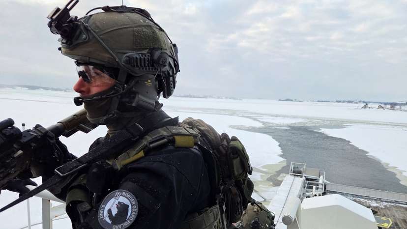 A member of the Finnish Border Guard's Special Intervention Unit takes part in an exercise on an offshore patrol vessel, Turva, near Helsinki on the Baltic Sea