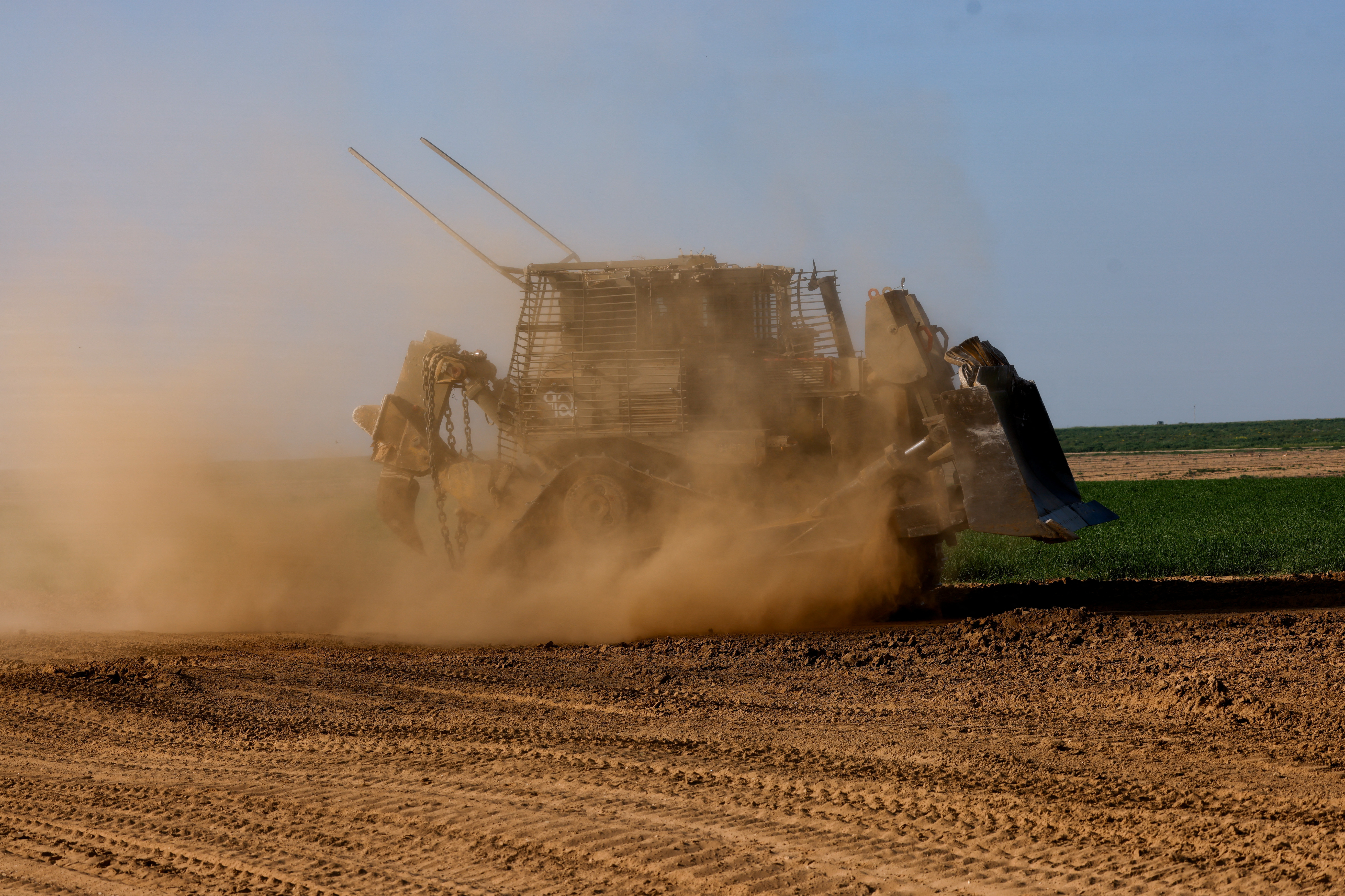 A D9 bulldozer maneuvres near the Israel-Gaza border