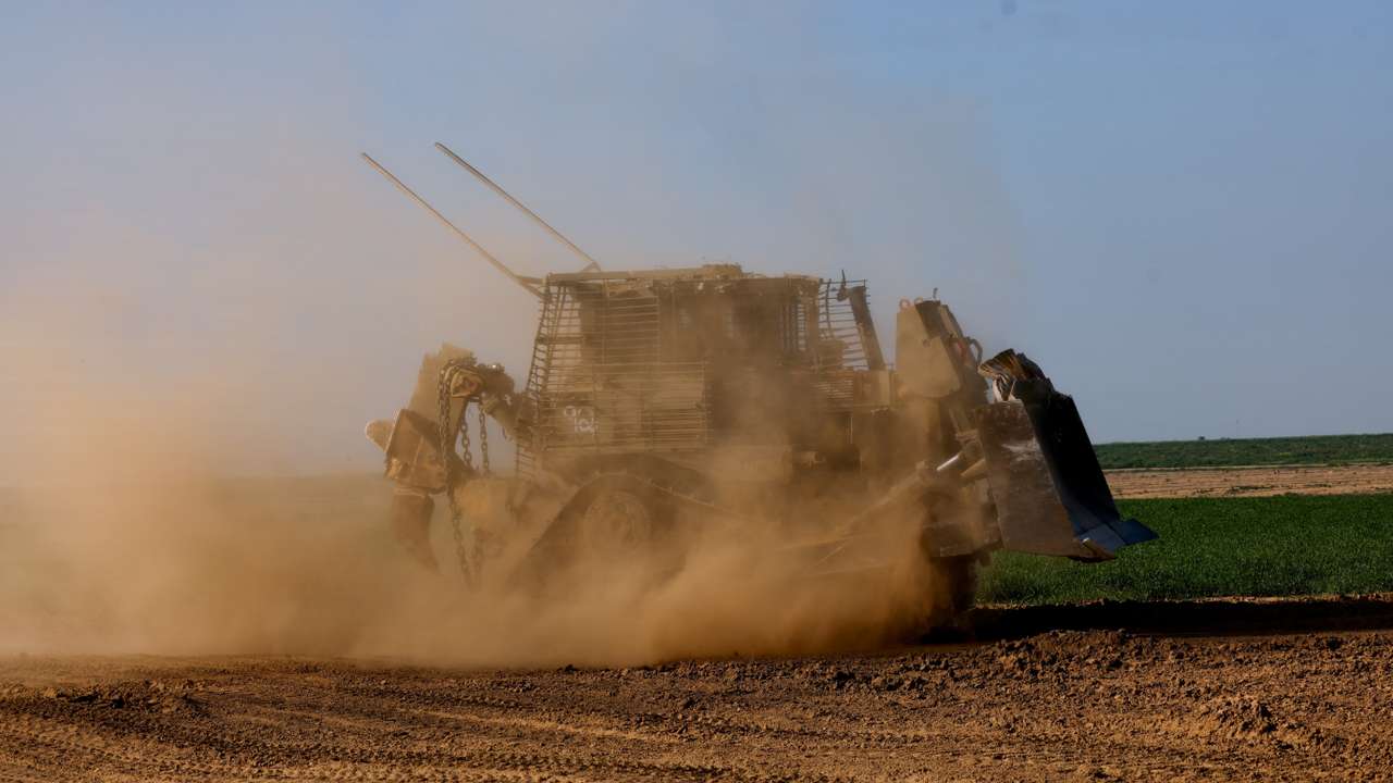 A D9 bulldozer maneuvres near the Israel-Gaza border