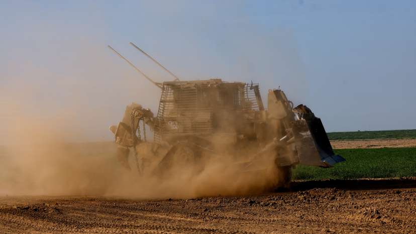 A D9 bulldozer maneuvres near the Israel-Gaza border