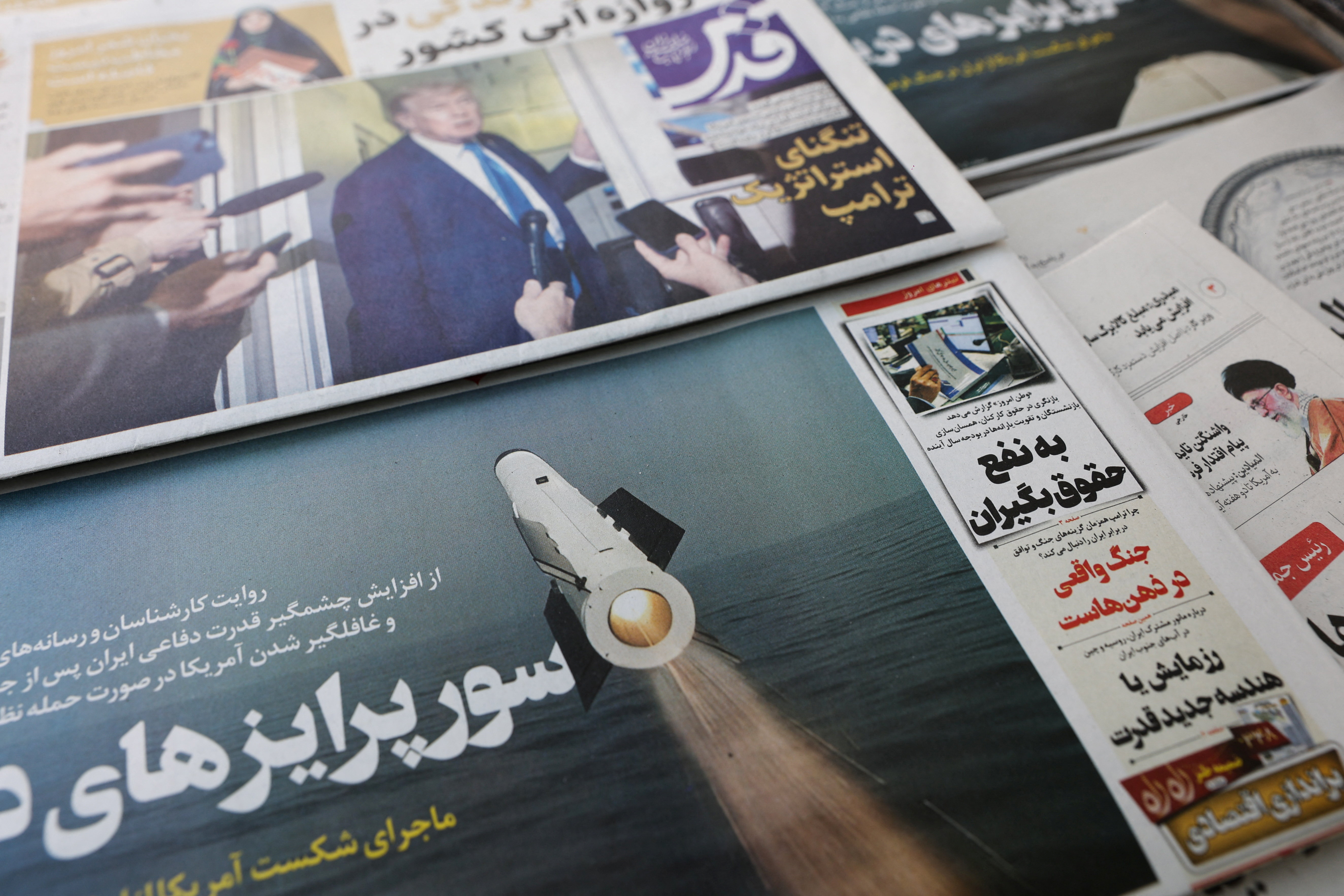 An Iranian newspaper with a cover photo of an Iranian missile, in Tehran