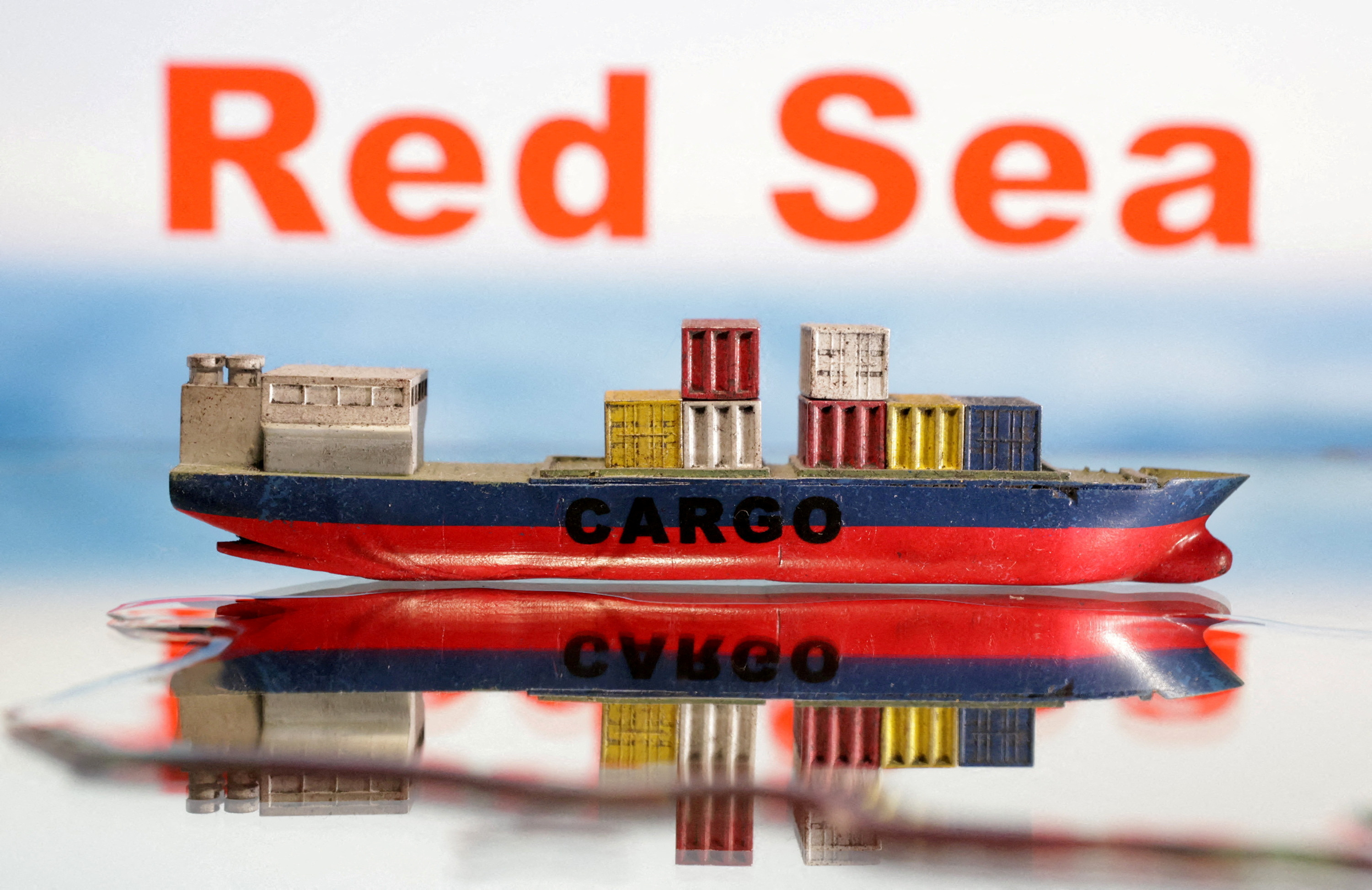 Illustration shows a cargo ship boat model and the words "Red Sea\
