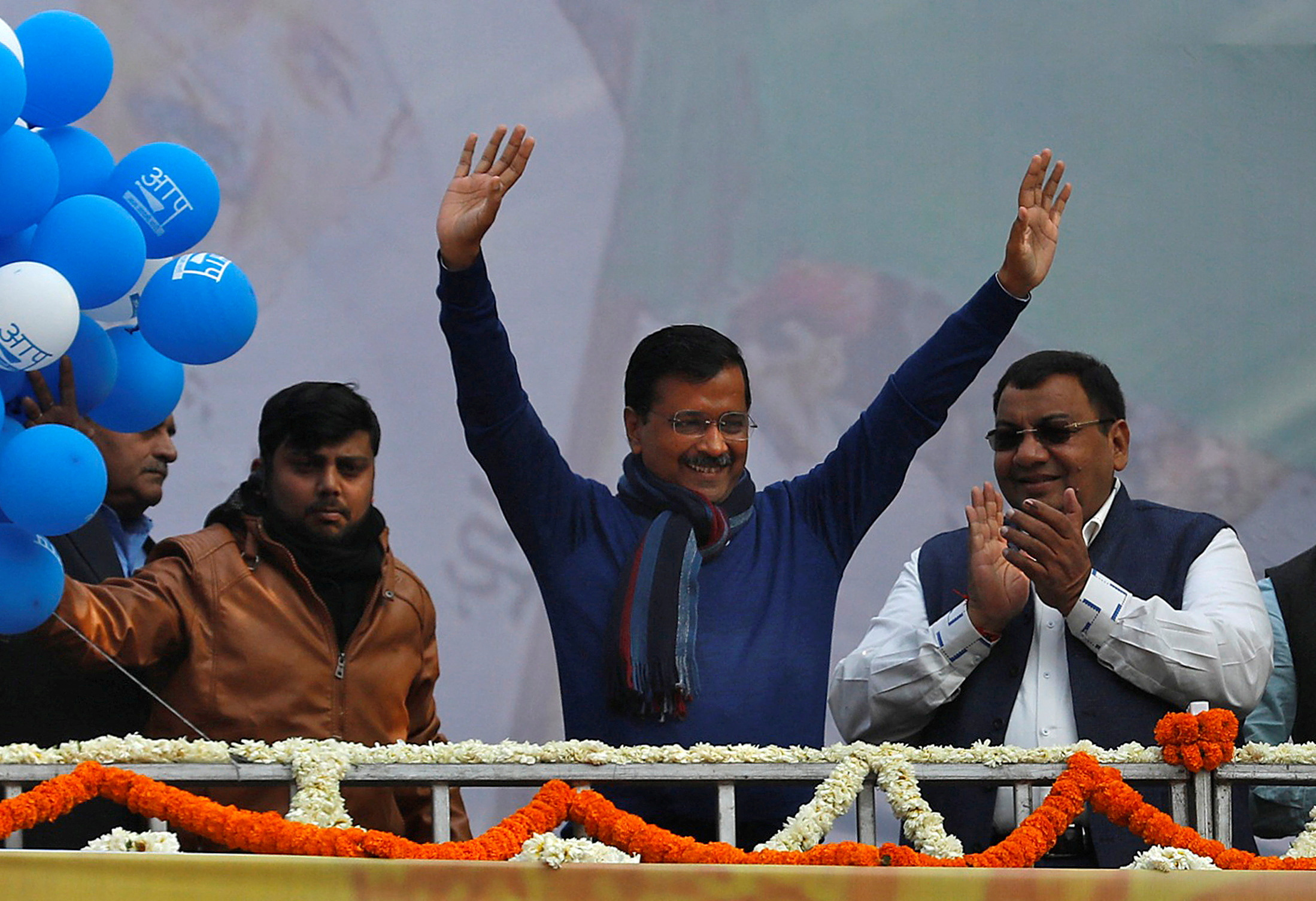 FILE PHOTO: Delhi Chief Minister and leader of Aam Aadmi Party Arvind Kejriwal waves to his supporters during celebrations at the party headquarters in New Delhi