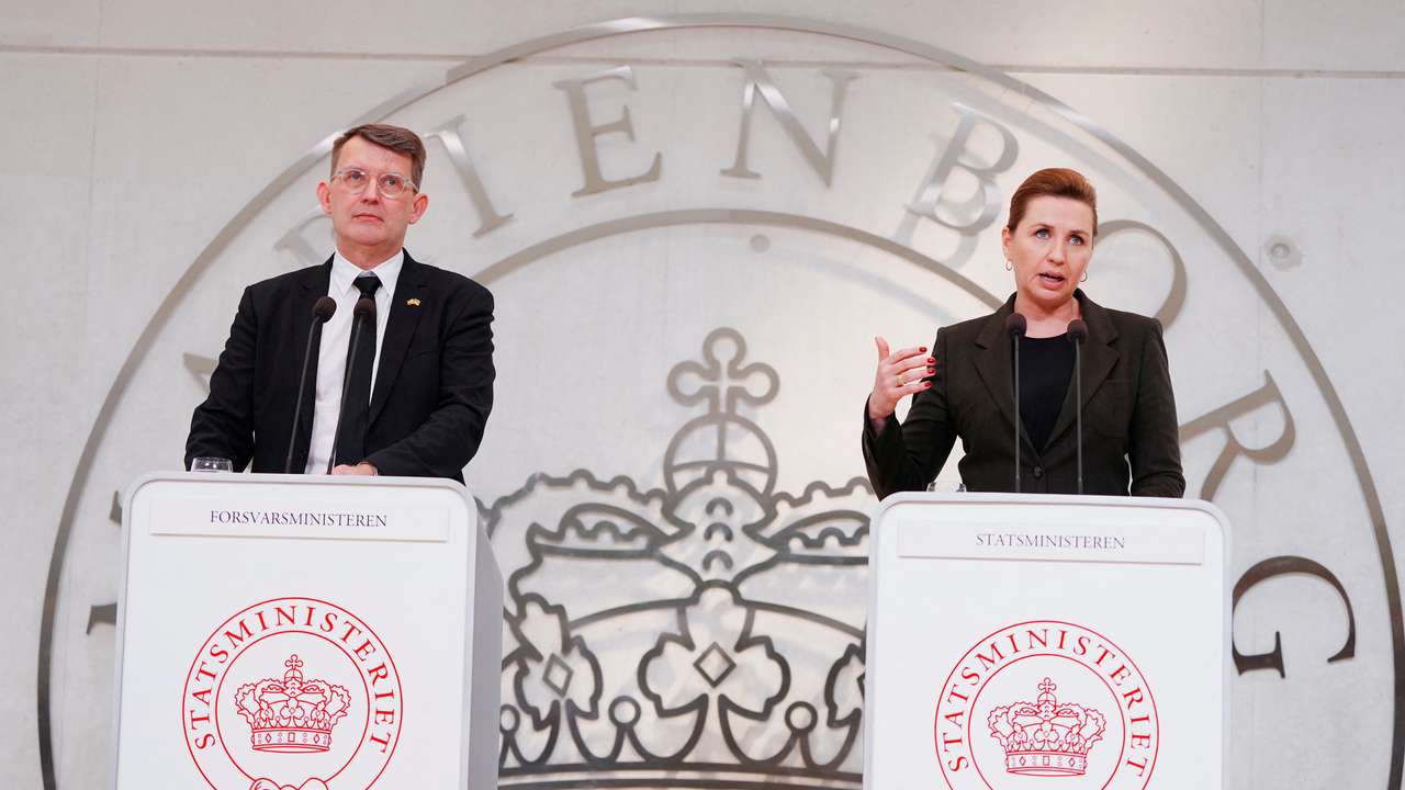 Danish Prime Minister Mette Frederiksen and Deputy Prime Minister and Minister of Defence Troels Lund Poulsen speak during a press conference in Copenhagn
