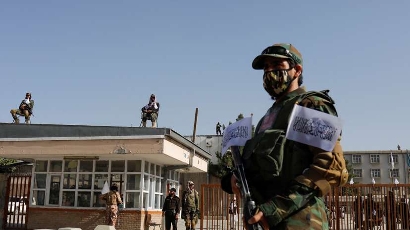 Taliban soldiers stand guard at the second-anniversary ceremony of the takeover of Kabul by the Taliban in Kabul