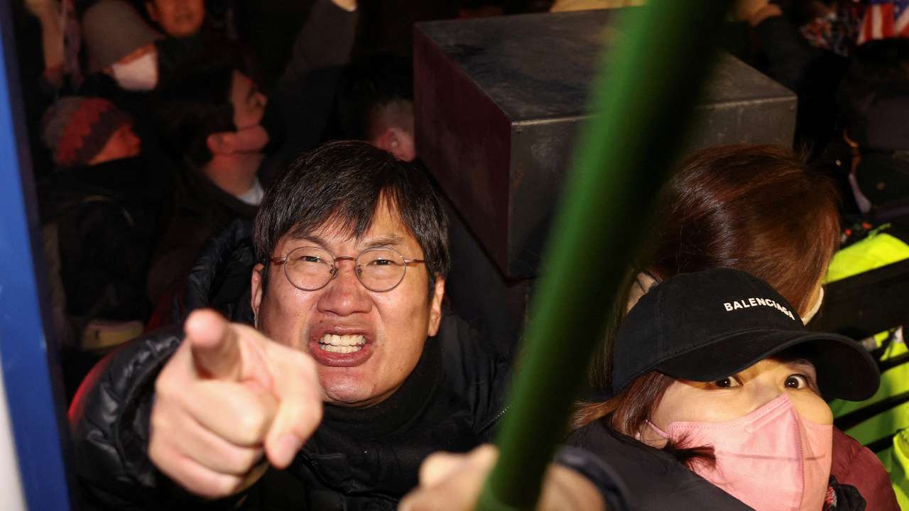Pro-Yoon protesters participate in a rally outside a court, in Seoul