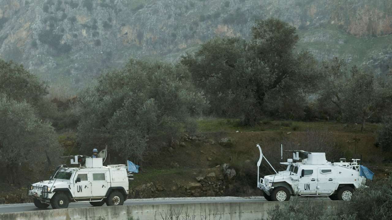 FILE PHOTO: UN peacekeepers (UNIFIL) vehicles ride along a street in Marjaayoun