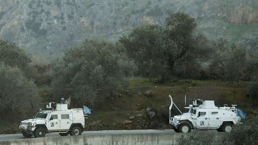 FILE PHOTO: UN peacekeepers (UNIFIL) vehicles ride along a street in Marjaayoun