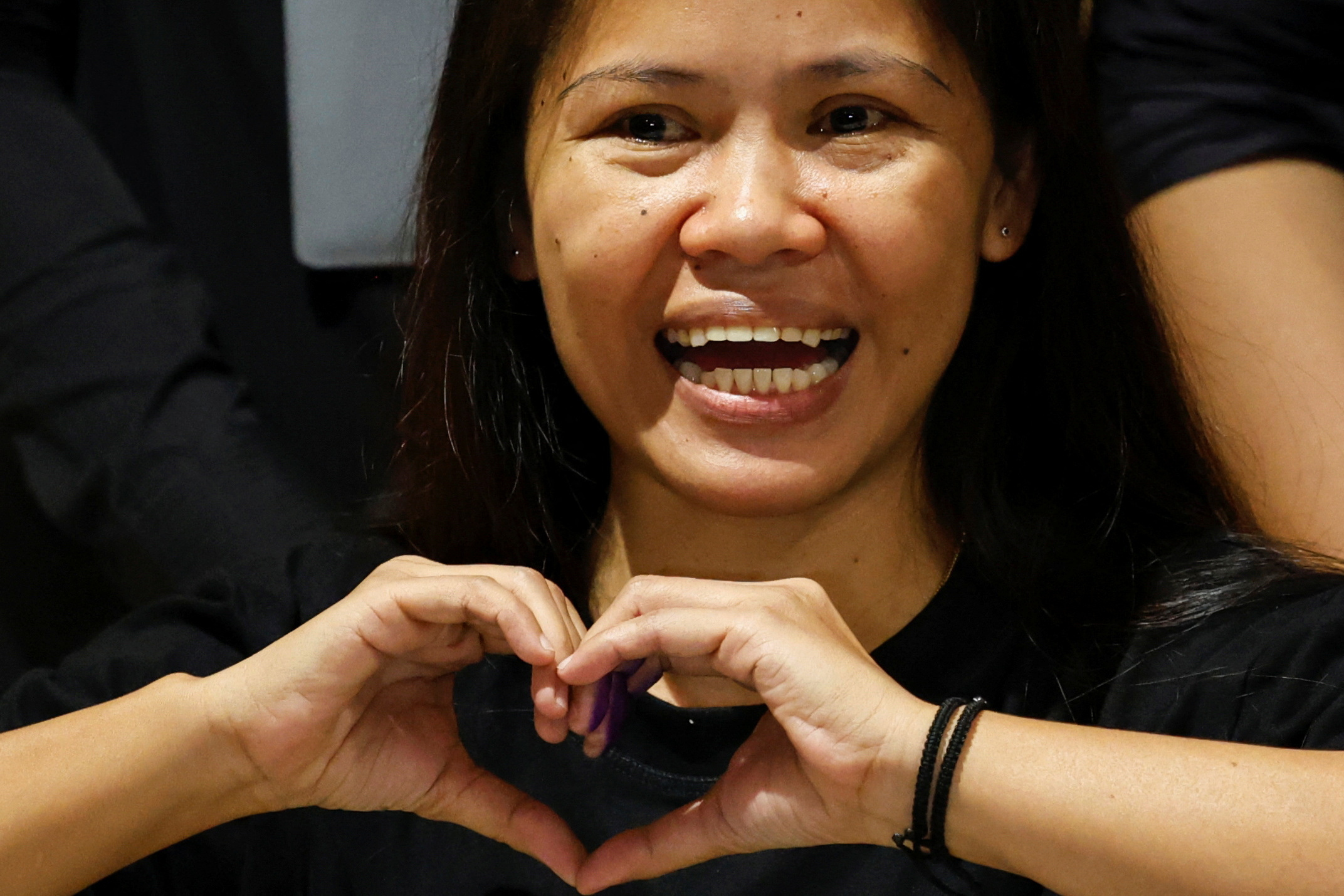 Philippine drug convict and former death row inmate Mary Jane Veloso gestures during a press conference, prior to her repatriation to the Philippines from Indonesia, at the Soekarno-Hatta Airport in Tangerang