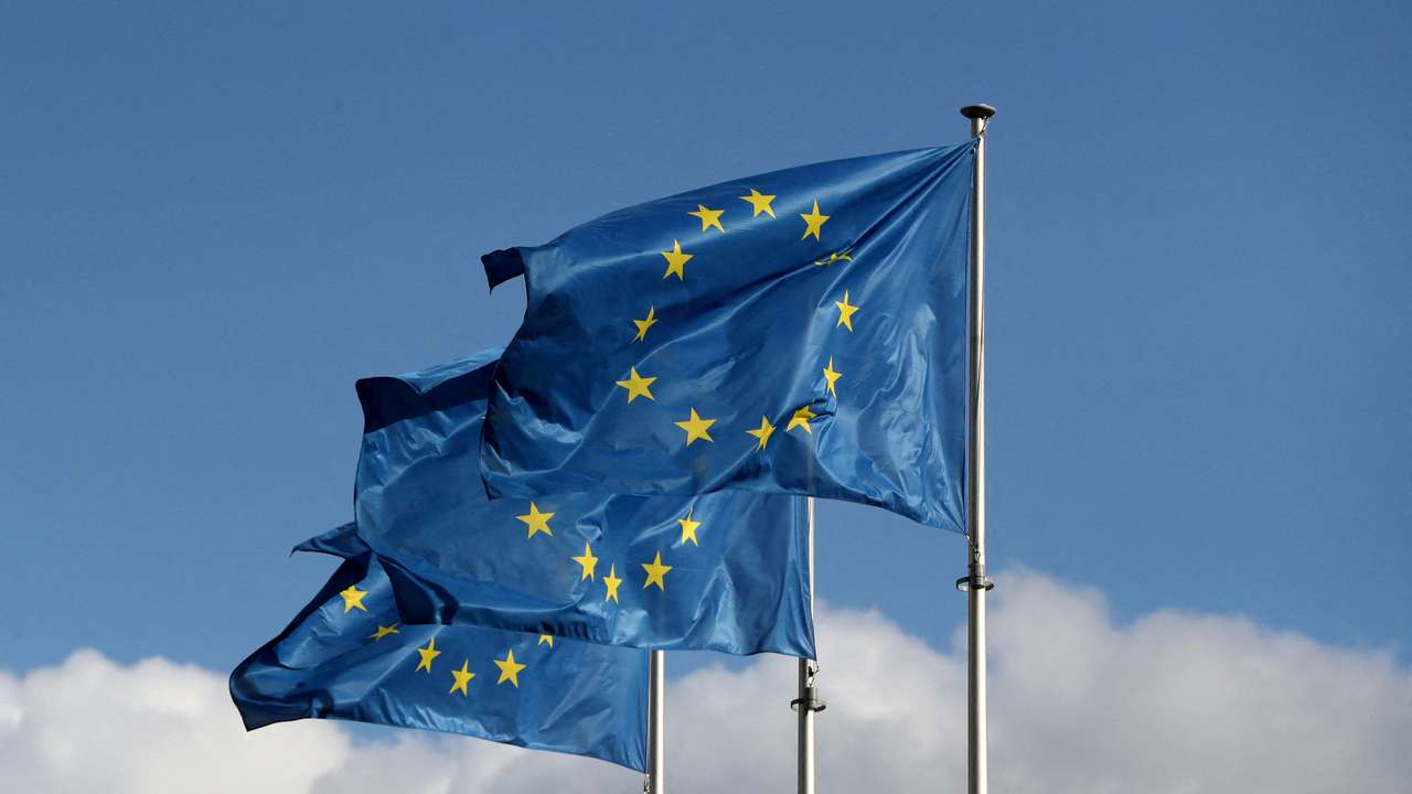 FILE PHOTO: European Union flags fly outside the EU Commission headquarters in Brussels